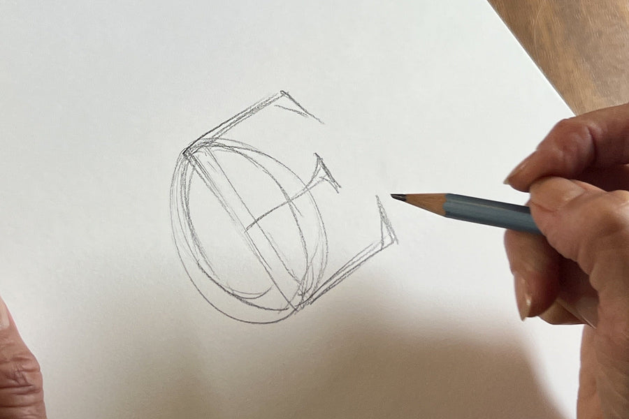 Two letters being drawn as one ligature in pencil