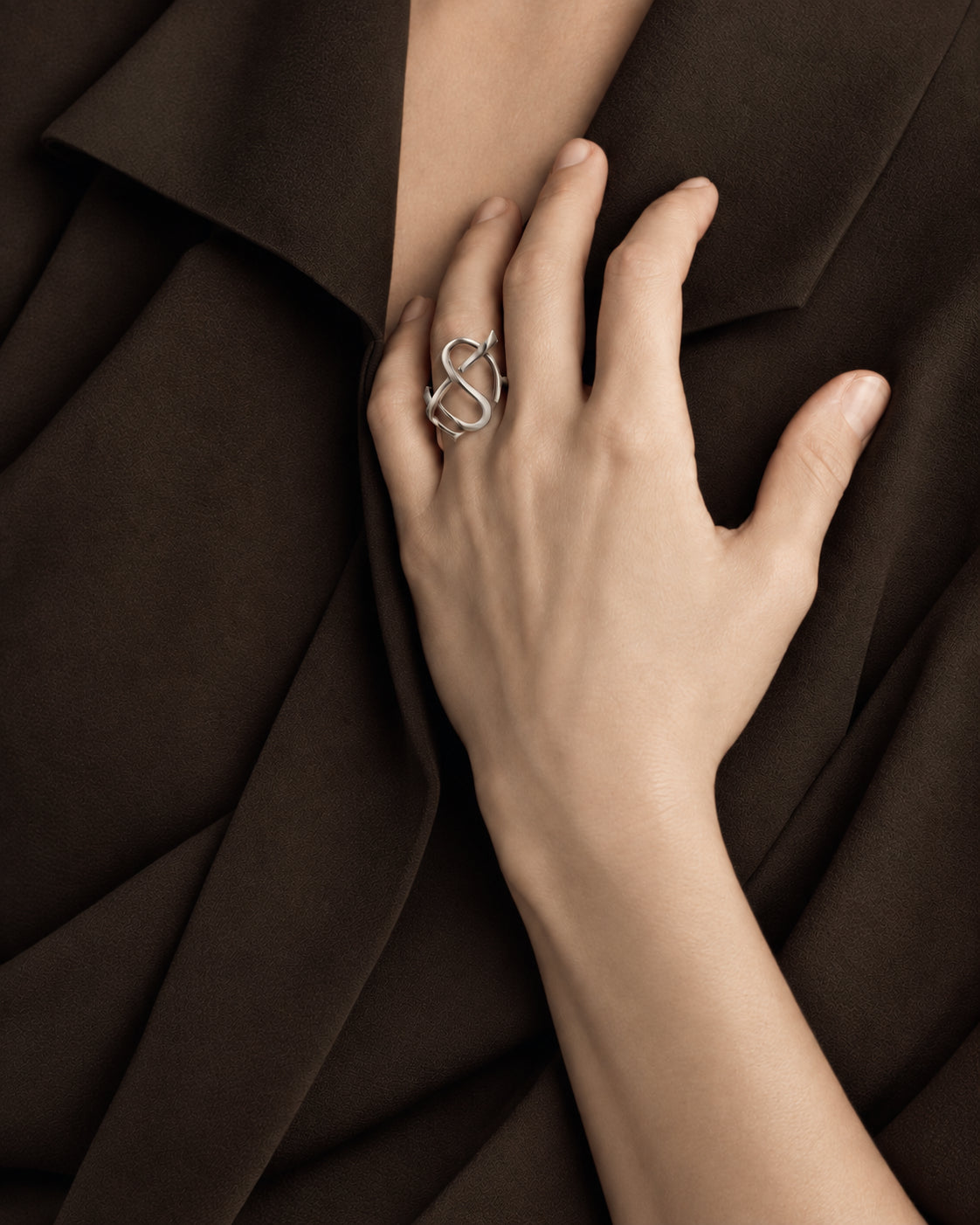 Entwined initials, worn as an earring and a ring